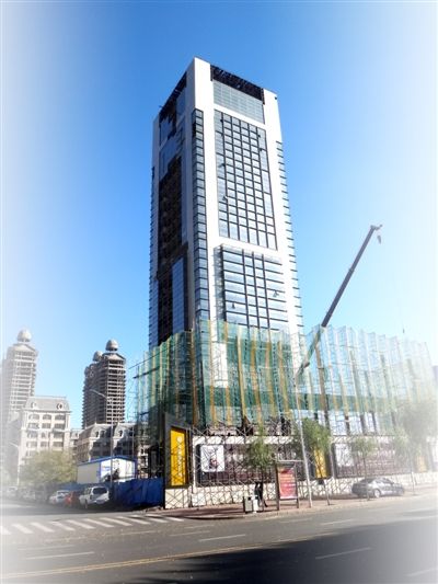 哈尔滨最老烂尾楼艺华大厦今年23岁(组图)